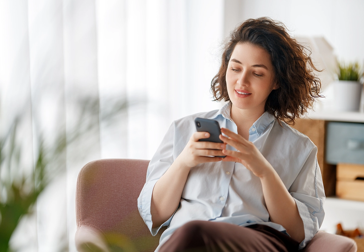 woman scrolling on phone