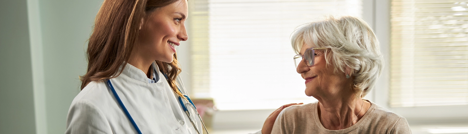woman and doctor smiling at each other